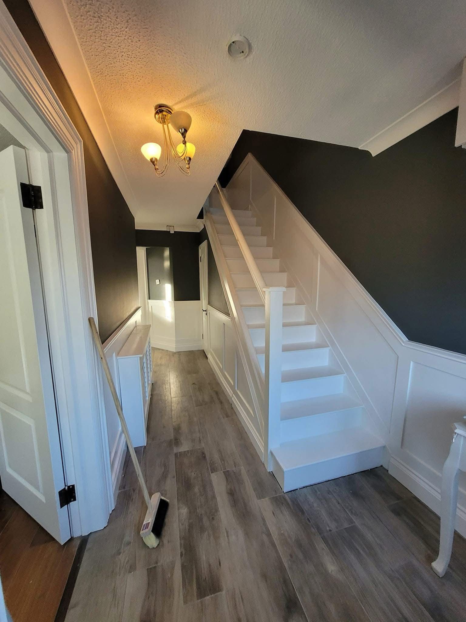 Banisters and stairs painted white and grey